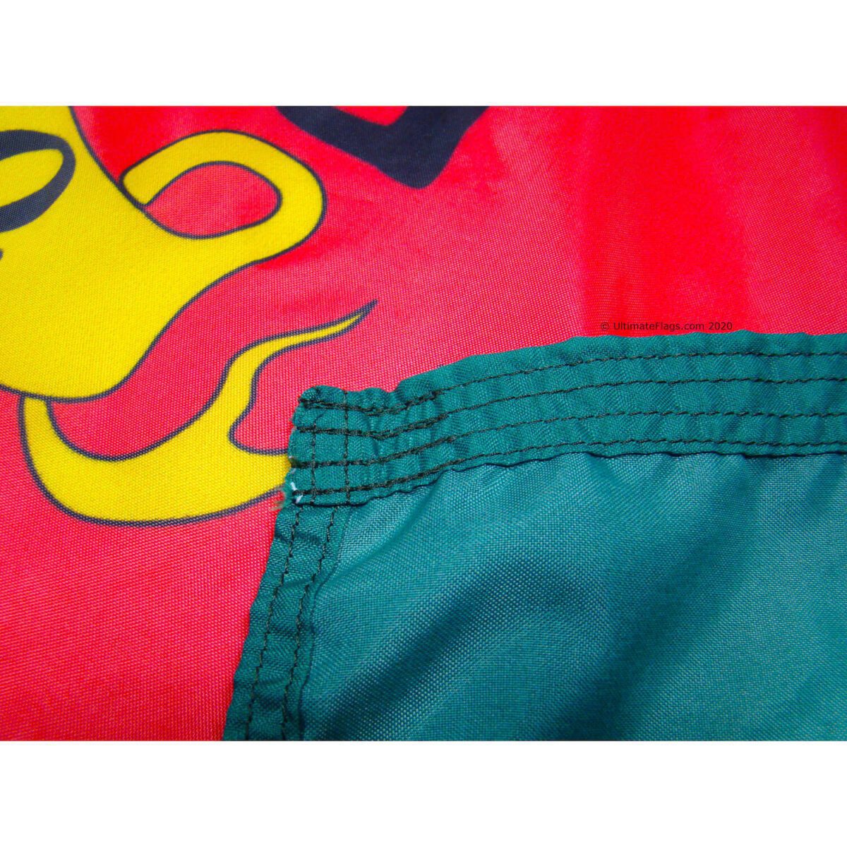 Vibrant close-up of a colorful flag featuring a unique design, showcasing high-quality stitching and durable fabric. Perfect for those looking to buy online affordable and eye-catching flags. Discover the best options at UltimateFlags.com.