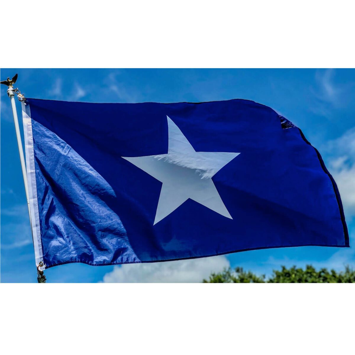 A vibrant blue flag featuring a prominent white star, perfect for showcasing your style. Ideal for anyone looking to buy online at affordable prices. Discover the best options for flags at UltimateFlags.com.
