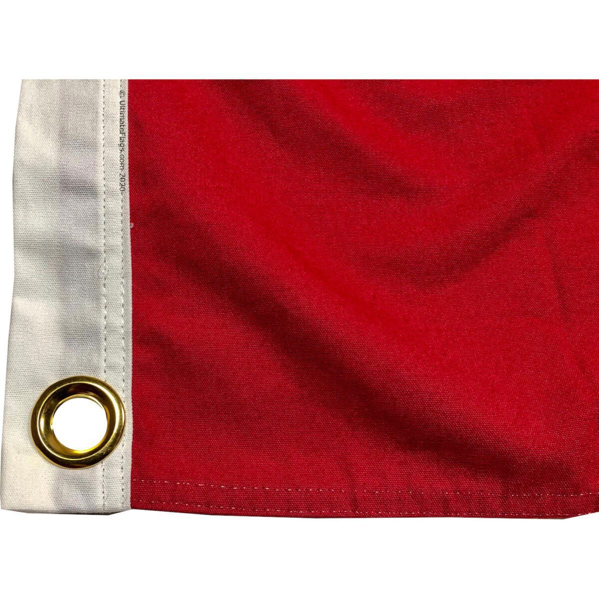 High-quality red flag with brass grommets, perfect for outdoor use. Buy online for the best selection of affordable flags at UltimateFlags.com.