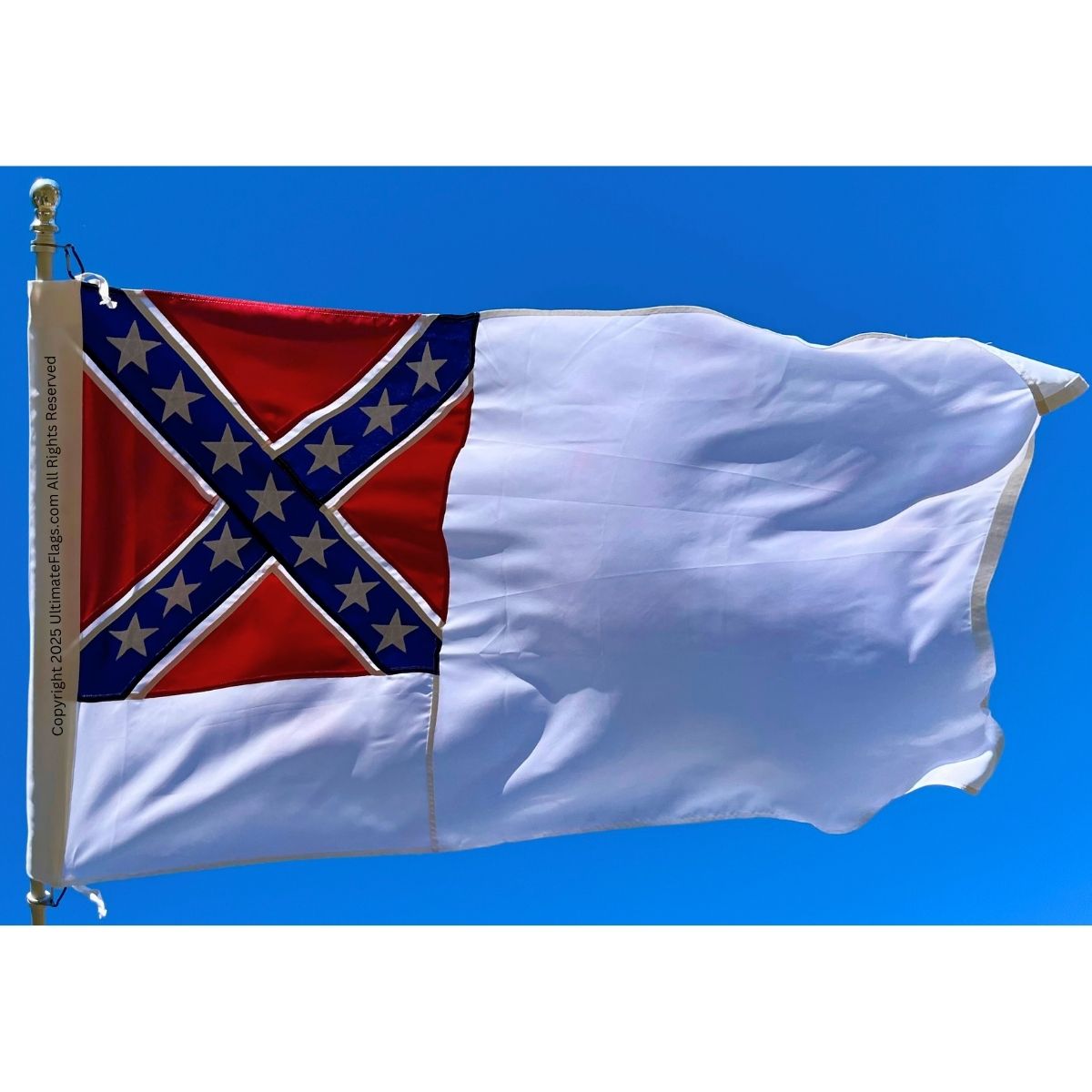 Confederate flag waving against a clear blue sky, showcasing vibrant colors and detailed design. This affordable flag is perfect for collectors or outdoor displays. Buy online at UltimateFlags.com for the best deals on quality flags.