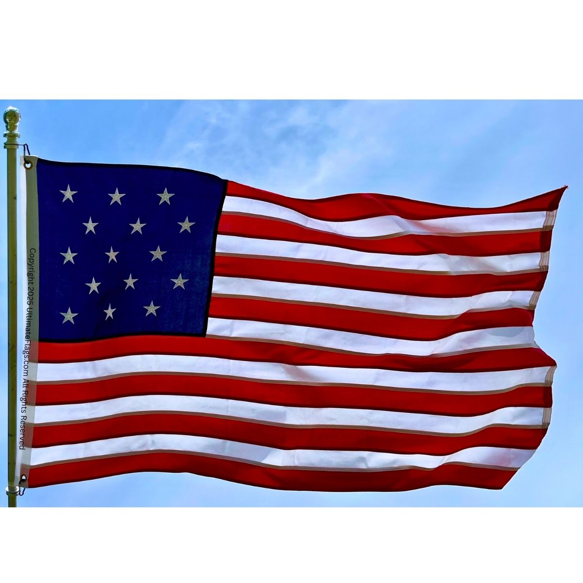 American flag waving against a clear blue sky, representing patriotism and national pride. Find cheap and affordable options to buy online for the best quality flags at UltimateFlags.com.