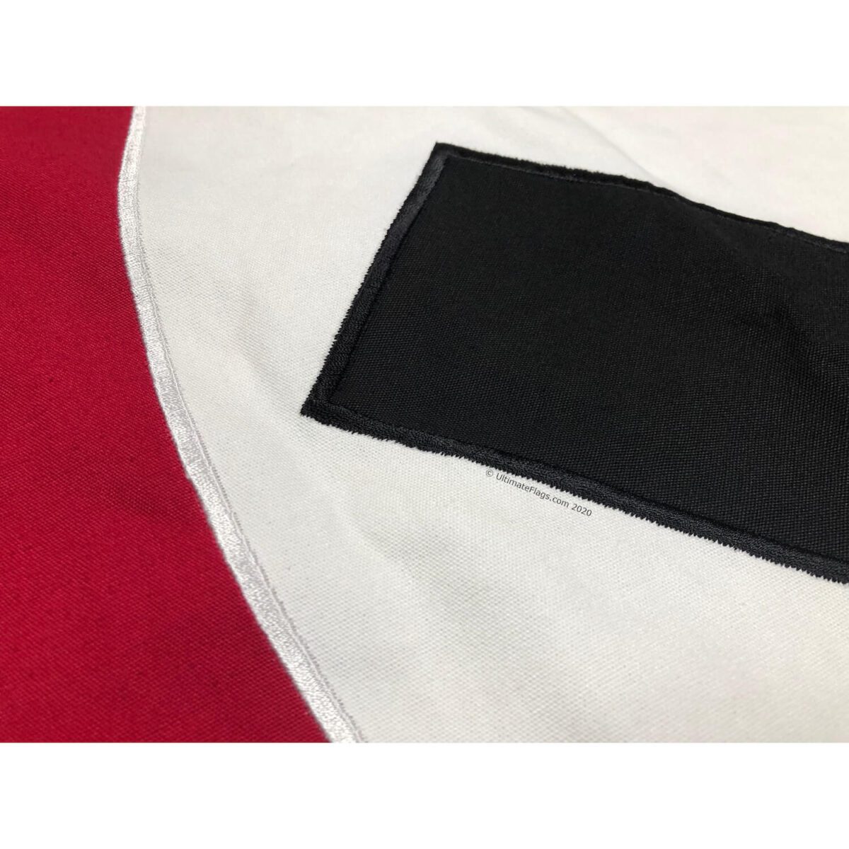 This image features a close-up of a replica Nazi flag with red and white colors, showcasing its quality and design. For those looking to buy online, this affordable flag is one of the best options available. Get your flag at UltimateFlags.com.
