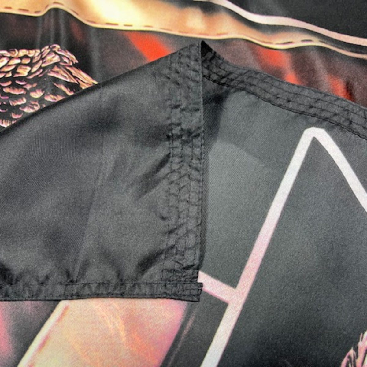 Close-up view of a high-quality flag showcasing detailed stitching and vibrant colors, ideal for outdoor display. Perfect for those looking to buy online at affordable prices. Explore the best options for cheap flags at UltimateFlags.com.