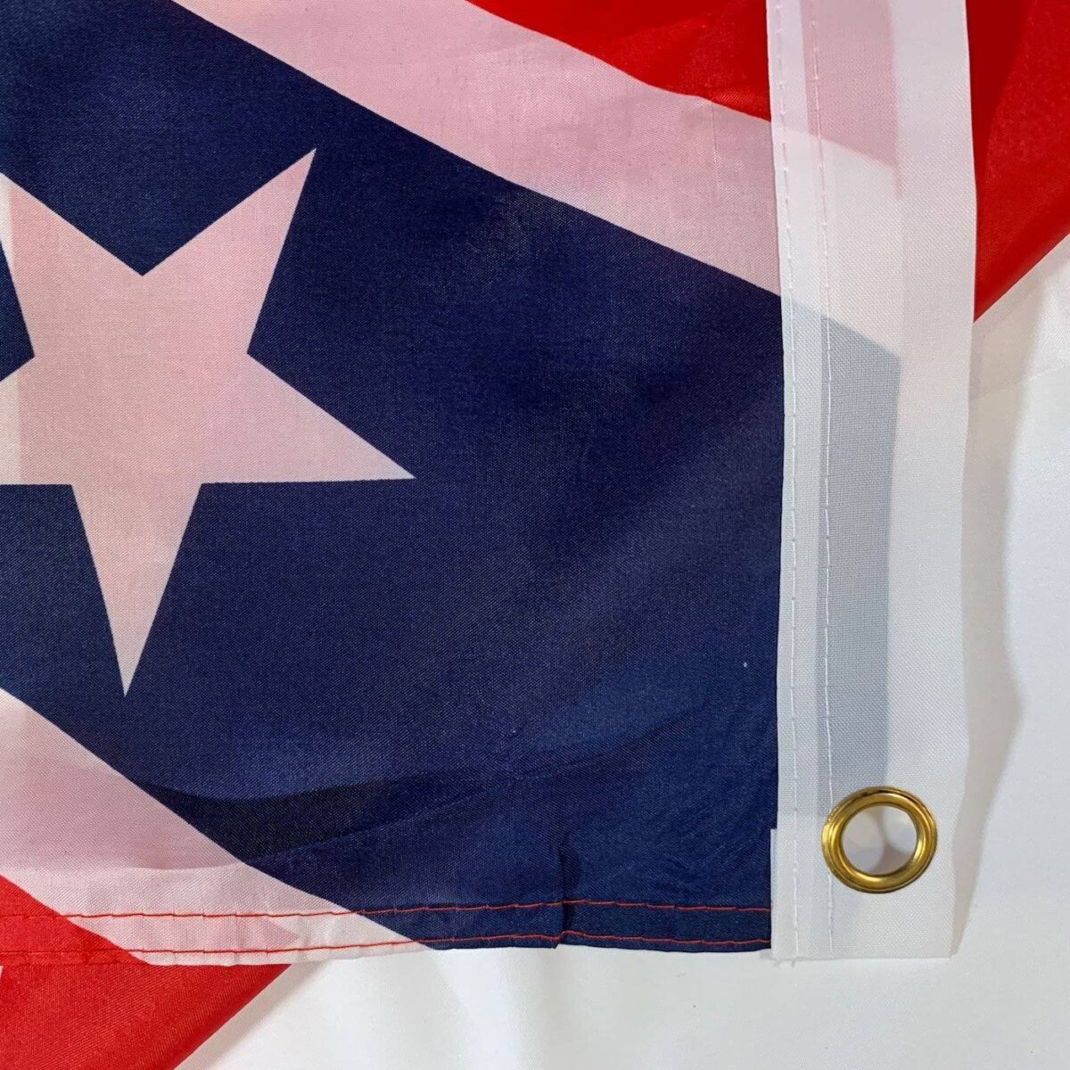 Confederate flag detail showcasing vibrant colors and sturdy grommet for easy hanging. Shop for cheap and affordable flags that represent your heritage. Find the best options to buy online at UltimateFlags.com.