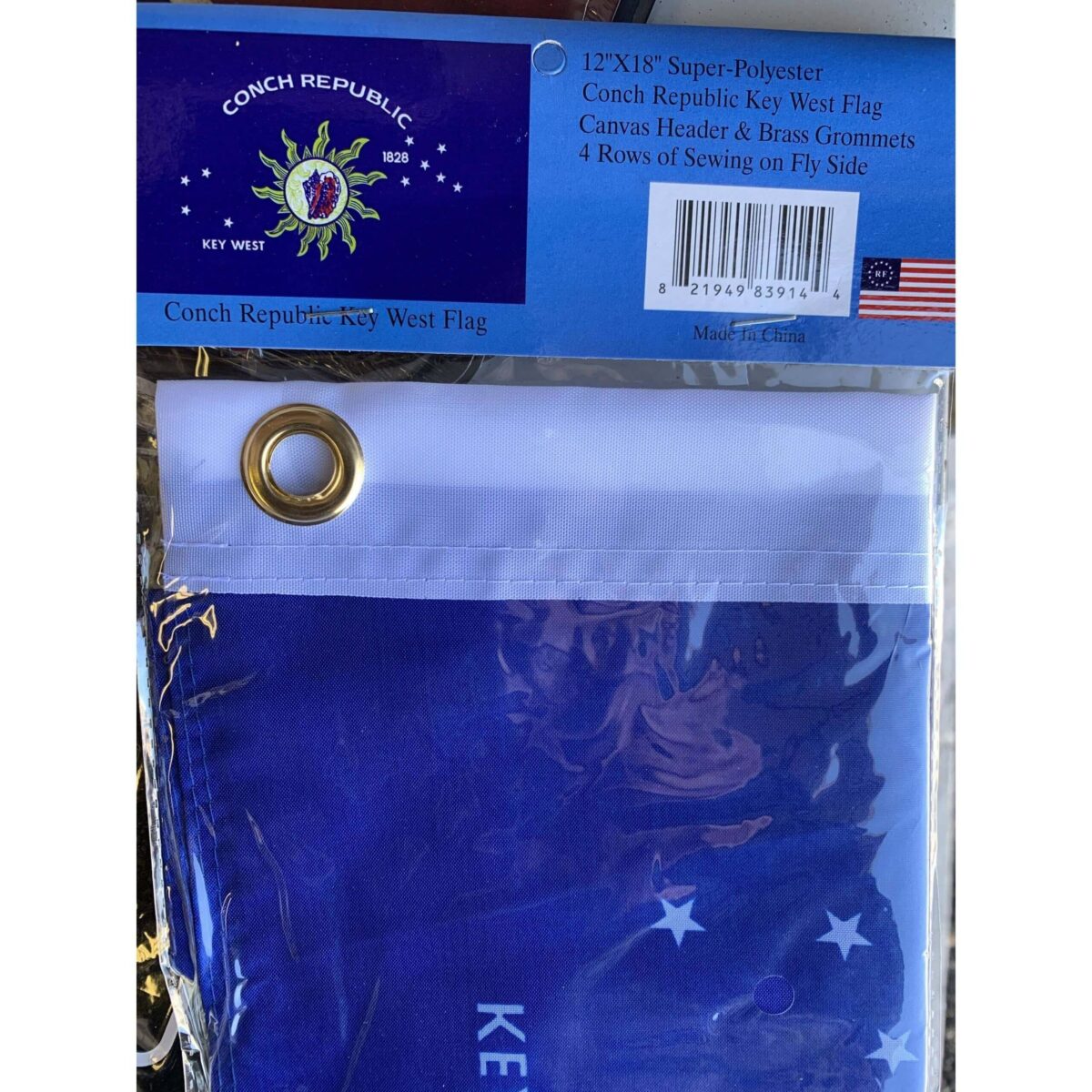 Kentucky state flag displayed in packaging, featuring vibrant colors and durable materials. This affordable flag is perfect for those looking to buy online without breaking the bank. Get the best quality at a cheap price from UltimateFlags.com.