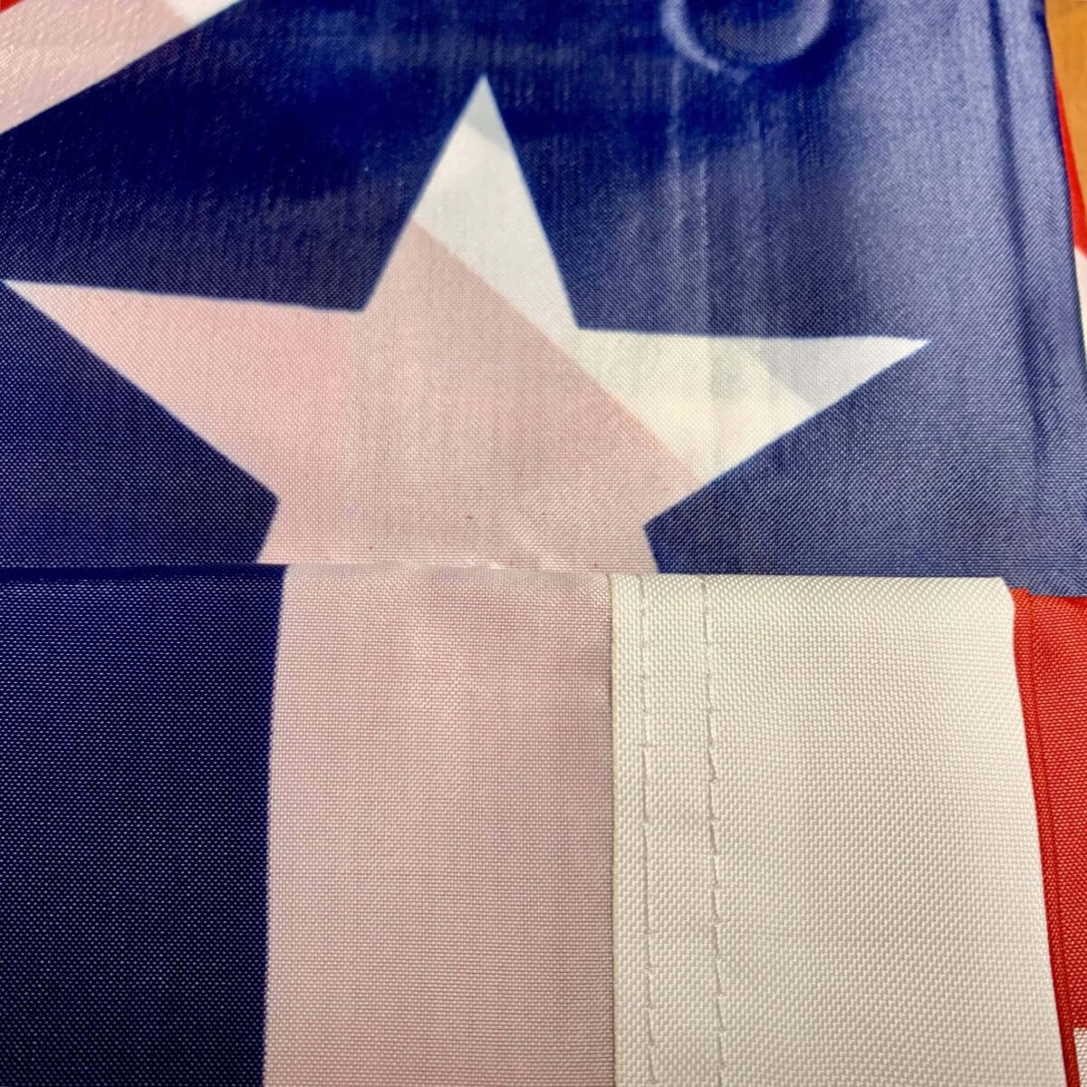 A close-up view of a Texas flag showcasing its vibrant colors and iconic star design. This flag is a great option for those looking to buy online at cheap and affordable prices. Discover the best deals on flags at UltimateFlags.com.