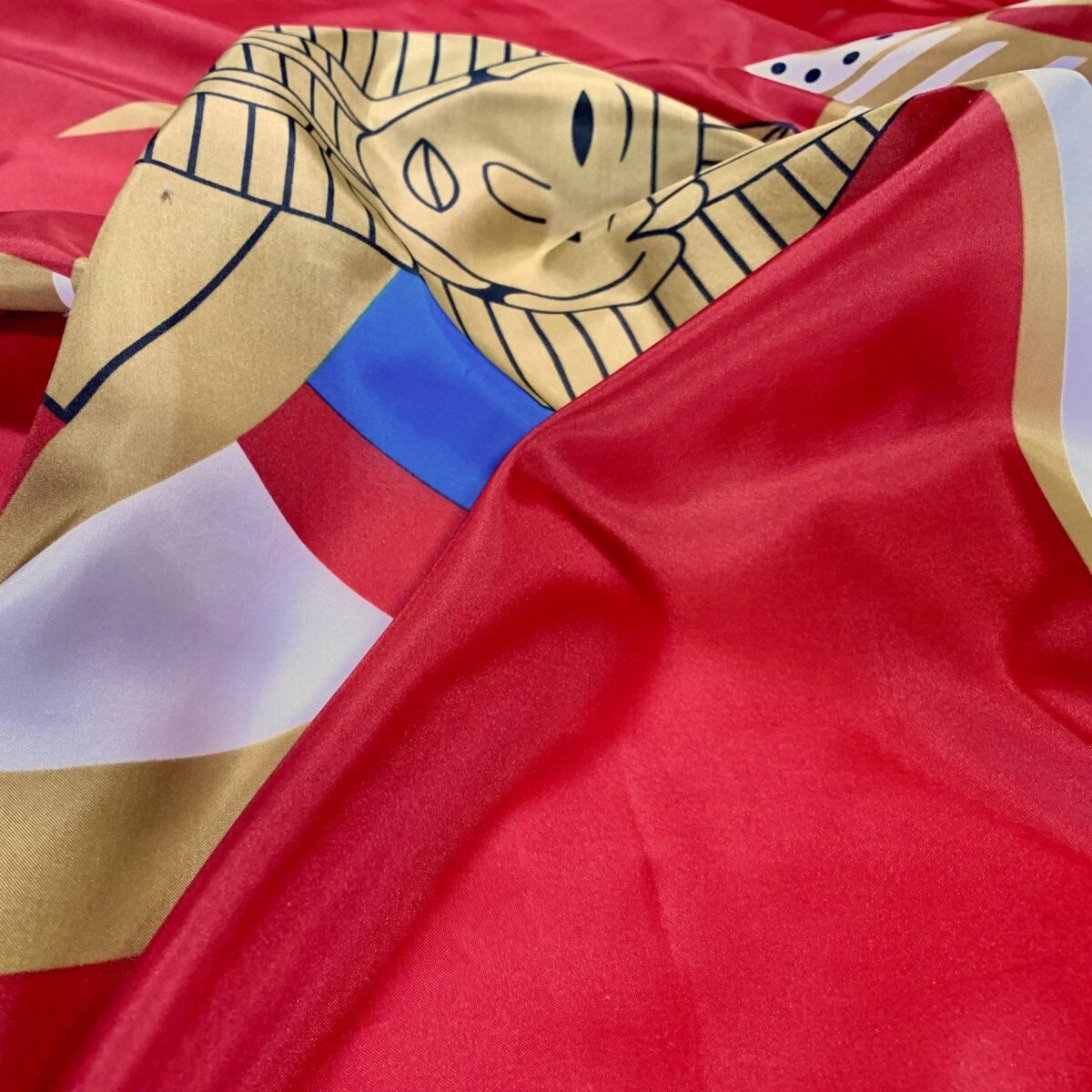 Vibrant flag featuring intricate designs in red, gold, and blue, perfect for showcasing national pride or decorative purposes. This affordable and high-quality flag is one of the best options to buy online for enthusiasts and collectors. Available at UltimateFlags.com.