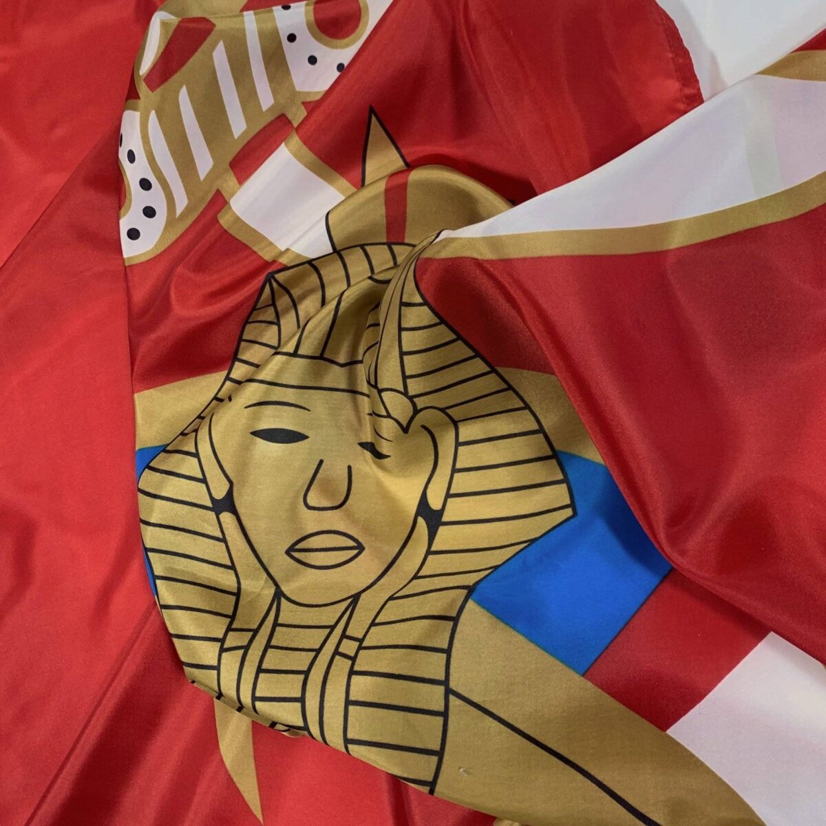 Vibrant Egyptian flag featuring an intricate design with a pharaoh's face, perfect for adding a touch of history and culture to your space. This affordable and eye-catching flag is ideal for collectors and enthusiasts alike. Buy online today at UltimateFlags.com.